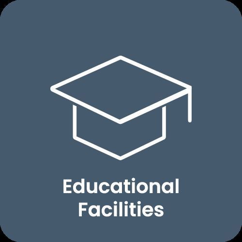 Icon of a graduation cap with the text 'Educational Facilities' below it on a blue background.