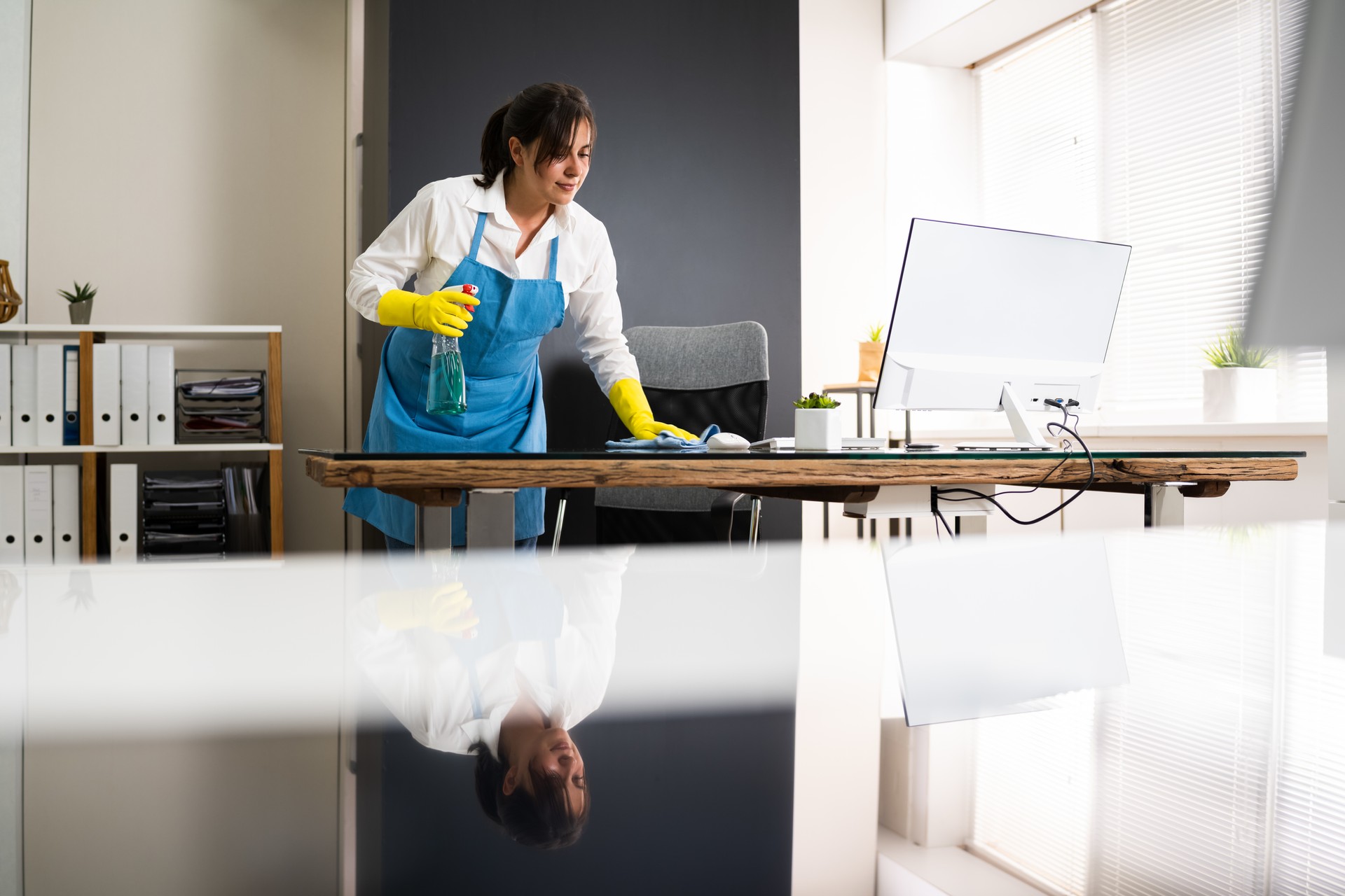 Janitor Cleaning Office Desk