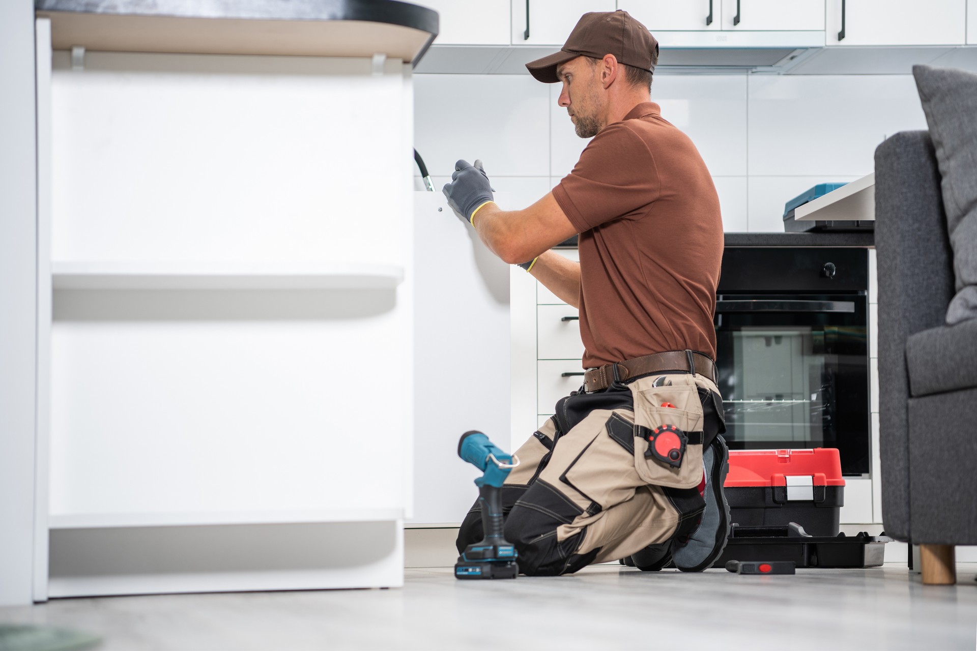 Professional Cabinetmaker Finishing New Kitchen Cabinets